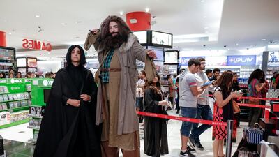 Fans cosplay as Harry Potter characters Professor Severus Snape and Hagrid at the Harry Potter and the Cursed Child book launch at the Mall of Emirates. Victor Besa / The National