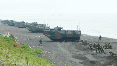 Assault Amphibious Vehicle Personnel carriers 7(AVV7) of the Japanese Ground Self-Defense Forces (JGSDF) make a beach landing during exercises in Hokkaido. AP Photo
