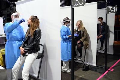 Health workers collect swab samples before a rock concert in Barcelona, Spain on Saturday. AFP