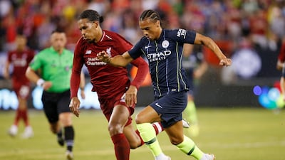 Liverpool's Virgil van Dijk in action with Manchester City's Leroy Sane. Reuters
