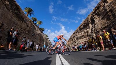 Spectators watch the cycling leg of the Triathlon Challenge race held in Mogan, Gran Canaria on the Canary Island on Saturday, April 24. EPA