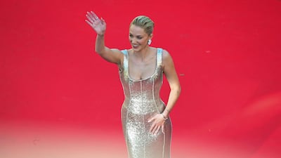American actress and professional kiteboarder Maika Monroe in a metallic silver gown by Saudi label Ashi Studio at Cannes Film Festival 2026. AFP