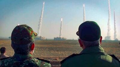 The head of Iran’s Islamic Revolutionary Guard Corps, Hossein Salami, right, watched a launch of missiles during a military drill in central Iran. AFP
