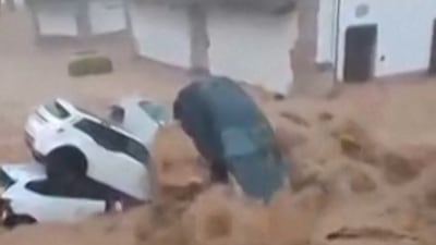Floodwaters sweep through streets in south-central Spain