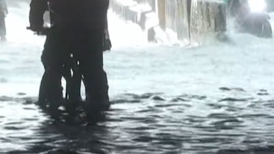 Monsoon rains flood Manila homes and streets