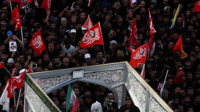 Hundreds of thousands mourn supreme leader as US and Tehran trade strikes