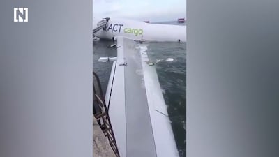 Two dead as cargo flight from Dubai skids off Hong Kong runway into sea