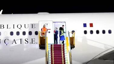 Macron caught off-guard as wife shoves him in face