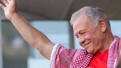 King Abdullah II greets crowd during Jordan vs Algeria game