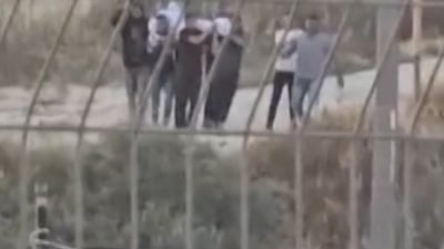 Israeli settlers force reburial of Palestinian father