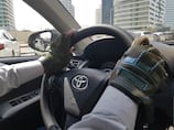 The story behind the gloves some Abu Dhabi taxi drivers wear