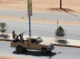 At least 18 killed in Houthi attack on Yemeni government military camp, sources say