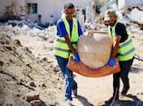 How young volunteers in Gaza are using their bare hands to dig through rubble and rescue cultural treasures