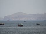 Dozens of ships escape Strait of Hormuz with US help