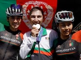 Afghan cyclist who dressed as a man to avoid Taliban wins silver medal at Asian Games
