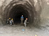 Nepal rescuers focus on workers trapped in tunnels after deadly flood