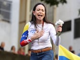 Nobel winner Machado says she'll return to Venezuela soon and calls for release of political prisoners