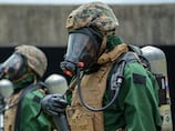 US troops drill on deck for contamination warfare in Iran