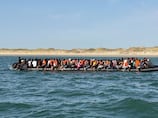 'Mega dinghy' carrying 230 migrants across Channel shows crackdown is working, says UK minister
