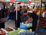 Israel says entry of commercial goods into Gaza halted amid dispute between traders and Hamas