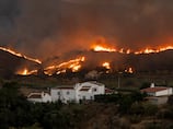 Raging wildfire kills 12 in southern Spain