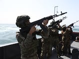 Iran tests military firepower but is ready to strike US deal to avoid 'gamble' of war