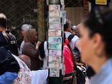 Iran's bazaar merchants squeezed as rial hits record low