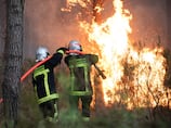 Macron warns France to dig in for weeks of wildfires