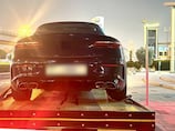 Dubai Police issue safety warning after reckless passenger sits on open door of moving car