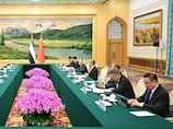 Khaldoon Al Mubarak meets China's Wang Yi to strengthen bilateral ties