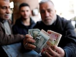 Iraq considers deleting zeros from dinar as officials revive currency overhaul